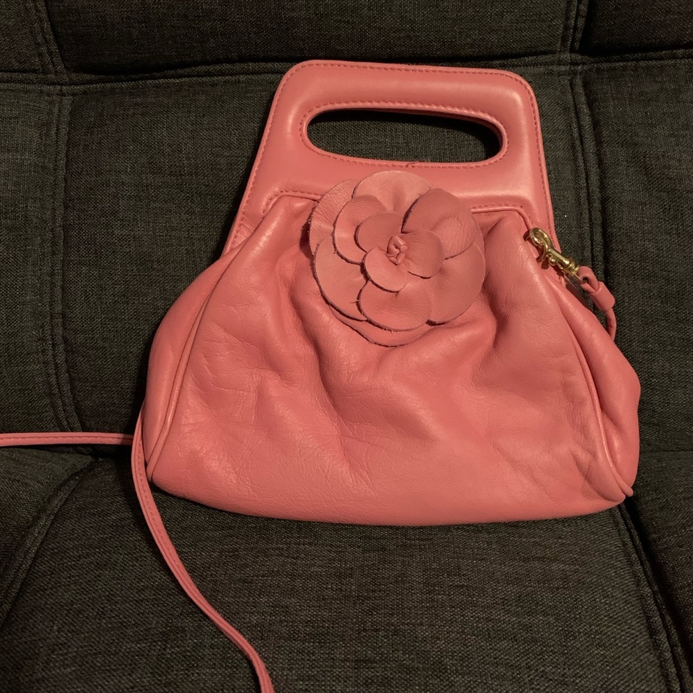 - PARADOX.  Pretty leather. Bag good conditions clean